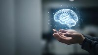 Human hand holding glowing digital brain hologram with neural network connections representing artificial intelligence and machine learning technology.