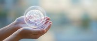 Hands holding glowing brain hologram representing mental health, neuroscience, psychology, cognitive function, mindfulness, and healthcare innovation concepts.
