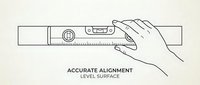 Hand holding spirit level tool for accurate measurement and alignment on construction surface with precise bubble indicator for professional building work.