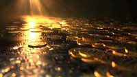 Golden coins scattered on dark surface with dramatic lighting and sun rays creating magical atmosphere of wealth and prosperity. Shallow depth of field.