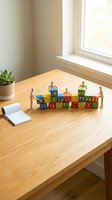 Wooden figures arranging colorful alphabet blocks spelling cooperation and organization on desk near window, with potted succulent and notepad for business teamwork concepts.