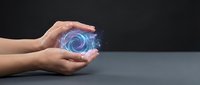 Hands holding glowing blue digital sphere with swirling energy vortex, representing technology, innovation, and data processing for business and digital transformation concepts.