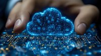 Glowing blue digital cloud symbol floating over circuit board with female hands, representing cloud computing technology and data storage solutions.