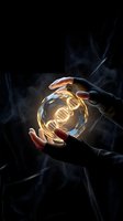 Hands holding glowing crystal ball with DNA helix inside against dark smoky background, representing science, biotechnology, genetic research, and future innovation.