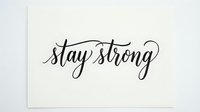 Stay strong motivational quote in elegant script lettering on white background, isolated for design use on merchandise, posters, and digital projects.