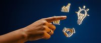 Young adult male hand pointing at glowing business icons including growth chart, lightbulb, and handshake on dark blue background for entrepreneurship and success concepts.