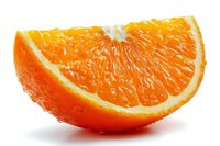 Juicy orange slice with bright pulp and thin peel isolated on white background, perfect for food advertising and healthy lifestyle concepts.