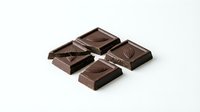 Dark chocolate pieces with decorative patterns isolated on white background, ready for food photography, confectionery design, and culinary content use.