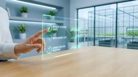 Professional hand touching holographic interface displaying sustainability metrics and environmental data in modern office workspace with green plants and city views.