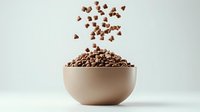 Chocolate chips falling into ceramic bowl against light background, dynamic food photography composition for cooking and baking concepts.