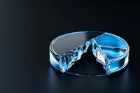 Circular pie chart made of blue transparent liquid with water splash effect on dark background, representing dynamic business data visualization and analytics.