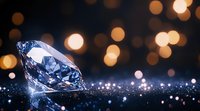 Large diamond on dark surface with golden bokeh lights in background creating luxurious atmosphere. Jewelry concept with sparkle and reflection effects.