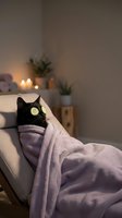 Black cat with cucumber eye mask relaxing on cozy chair wrapped in purple blanket. Spa wellness self-care concept for home relaxation and stress relief.