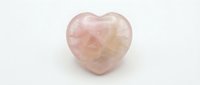 Rose quartz heart stone isolated on white background, polished crystal gemstone for wellness, meditation, and decorative home design use.