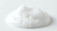 Pile of white crystalline powder isolated on light background, suitable for product photography, cosmetics, food ingredients, and design applications.