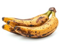 Ripe spotted bananas with brown marks on yellow peel isolated on white background, showing natural aging process and peak sweetness for baking and cooking.