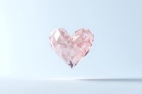 Geometric rose quartz heart shape with faceted crystal structure floating on light background with soft shadow, romantic minimal concept for valentines.