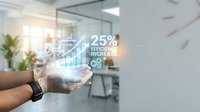 Professional businessman analyzing digital efficiency metrics and growth statistics with holographic data visualization in modern office environment.