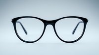 Black cat-eye glasses frame on light background, front view close up shot of modern eyewear accessory for vision correction and fashion styling.