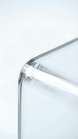 Close-up detail of transparent glass container edge with smooth curved rim against clean white background for modern kitchen and laboratory use.