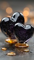 Glass heart decorations with galaxy sparkles and warm bokeh lights create romantic atmosphere for Valentine's Day celebrations and love themes.