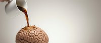 Coffee being poured from white cup onto human brain model representing caffeine effects on mental alertness and cognitive function for health concepts.