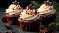 Chocolate cupcakes with vanilla buttercream frosting topped with star-shaped cookies and red berries on dark background with winter spices and pine branches.