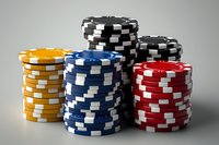 Colorful casino poker chips stacked in towers showing yellow, blue, black, and red gaming tokens for gambling entertainment and betting games.