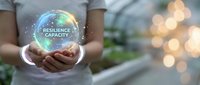 Professional woman holding glowing sphere with resilience capacity text, business leadership and personal development concept for corporate training.