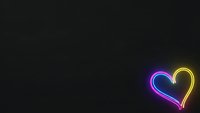 Vibrant neon heart glowing in purple and yellow colors against dark background for romantic designs and love-themed projects.
