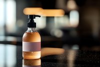 Elegant cosmetic pump bottle with blank label on dark reflective surface, warm ambient lighting creates luxurious mood. Perfect for beauty product marketing.