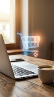 Glowing digital shopping cart hologram floating above a laptop on a wooden desk with coffee cup, symbolizing e-commerce and online shopping.