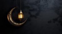 Glowing lantern hanging from decorative golden crescent moon against dark night sky background, creating mystical Ramadan atmosphere and festive mood.
