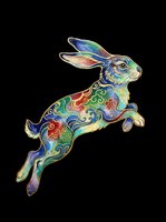 Colorful decorative rabbit leaping with vibrant ornamental patterns in blue, green, red and gold. Isolated on transparent background, ready for t-shirts, stickers, clipart and print-on-demand designs.