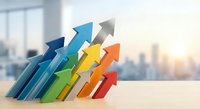Colorful arrows pointing upward representing business growth, success, progress and achievement in modern office environment with city skyline background.