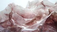 Ethereal rose gold liquid art with shimmering particles flowing in smooth waves creates dreamy abstract background for luxury design projects.