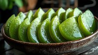 Fresh sliced aloe vera plant in rustic ceramic bowl, natural skincare ingredient for cosmetic products and healing remedies.