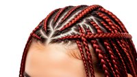 Close-up of African American woman with intricate red and black braided hairstyle showing detailed cornrow patterns and colorful hair extensions.