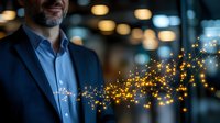 Middle-aged Caucasian businessman in blue suit with glowing golden network particles emerging from chest, symbolizing innovation and digital transformation.