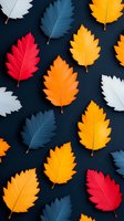 Colorful autumn leaves pattern with red, orange, yellow, blue and white foliage arranged on dark background. Seasonal flat lay composition for fall designs.