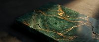 Luxurious green marble stone slab with golden veining patterns for interior design and architectural applications in modern spaces.