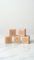 Wooden blocks with financial security icons including shield, lock, house, piggy bank and arrow symbols for investment and protection concepts.