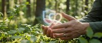 Hands protecting glowing CO2 symbol in green forest environment representing carbon footprint reduction and environmental conservation efforts.