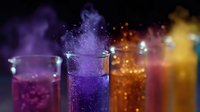 Colorful chemical reactions in glass test tubes with purple, orange and yellow smoke effects against dark background, dramatic laboratory experiment.