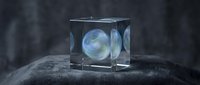 Glowing luminescent sphere encased in transparent crystal cube on dark textured stone surface, ethereal blue light emanating from within, suitable for mystical and sci-fi designs.