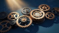 Mechanical gears and cogs in golden bronze tones with dramatic lighting on dark blue background. Industrial machinery concept for engineering and technology projects.