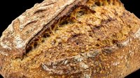 Rustic whole grain sourdough bread loaf isolated on transparent background, ready for bakery menus, food blogs, stickers, t-shirt design, and print on demand projects.