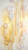 Abstract golden watercolor drips with iridescent soap bubbles on textured paper background for luxury design projects and artistic compositions.