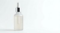 Clear glass dropper bottle with white pipette cap isolated on white background for skincare serum cosmetic product packaging design.