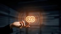 Hand holding glowing cryptocurrency coin symbol with golden light and digital ripple effect on dark background for blockchain technology concepts.